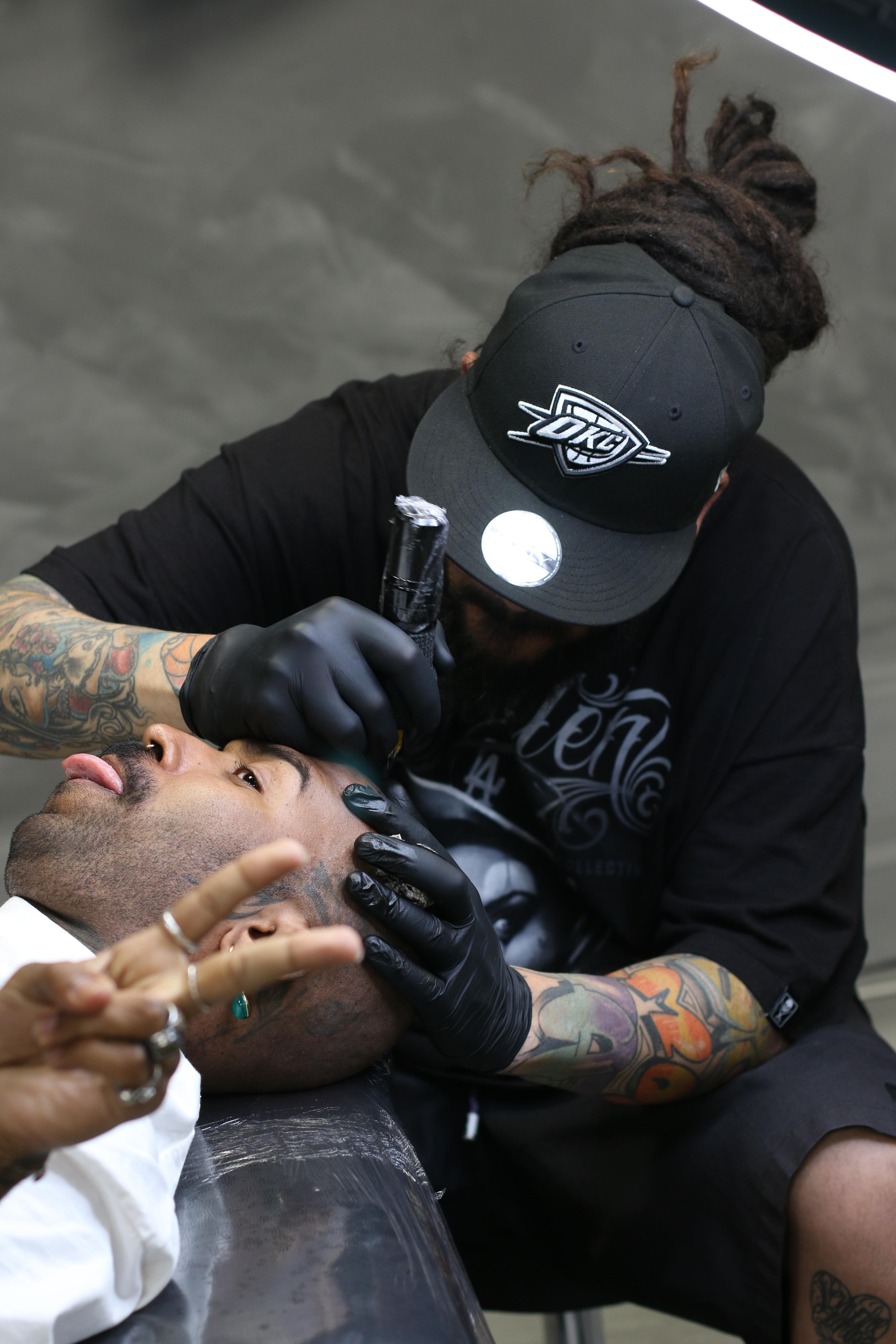 Tattoo artist working in the studio